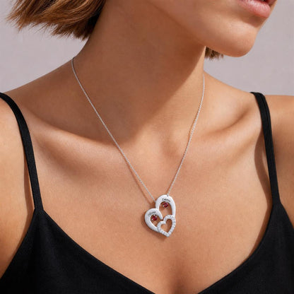 Woman wearing a two heart necklace