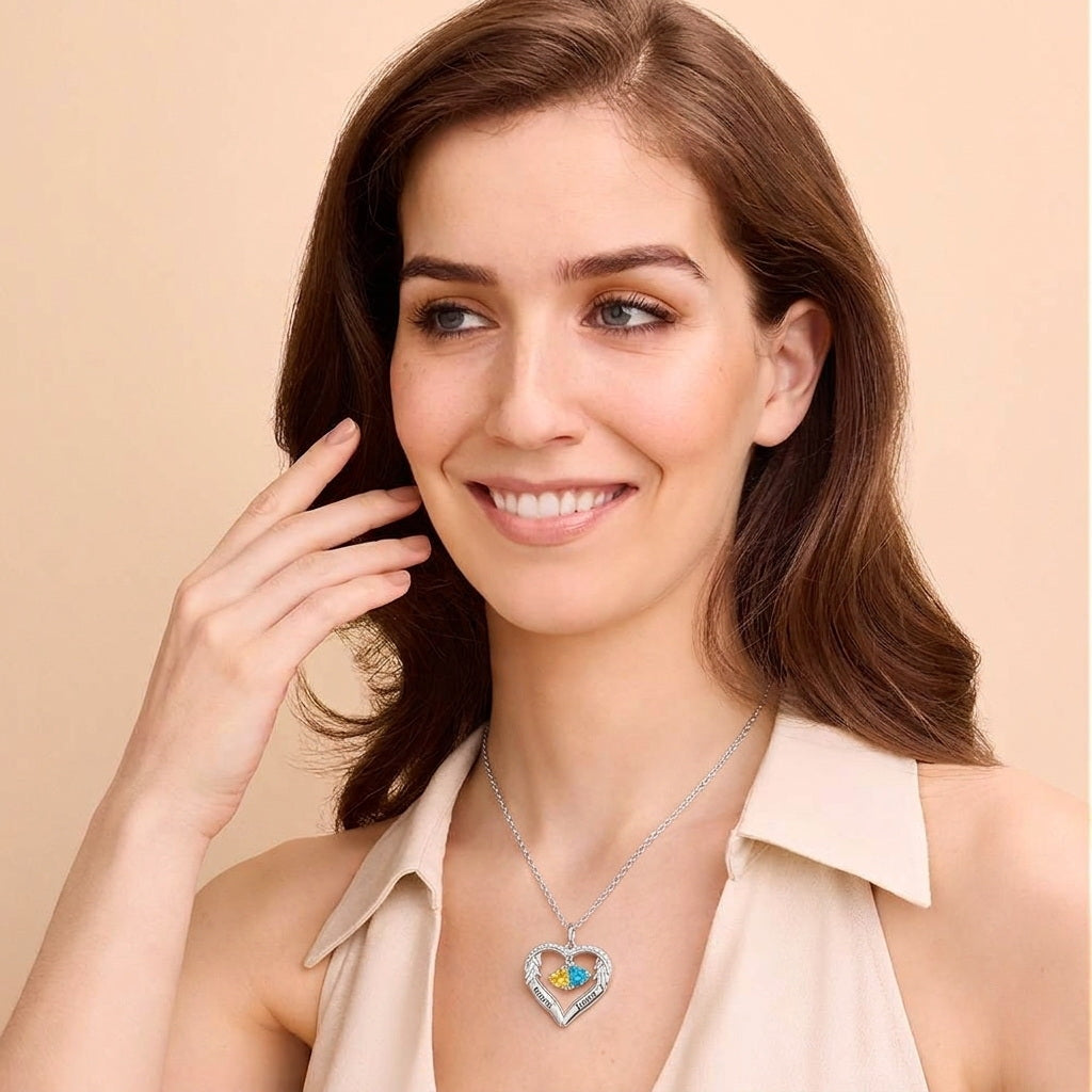 Woman wearing a two-name birthstone heart necklace