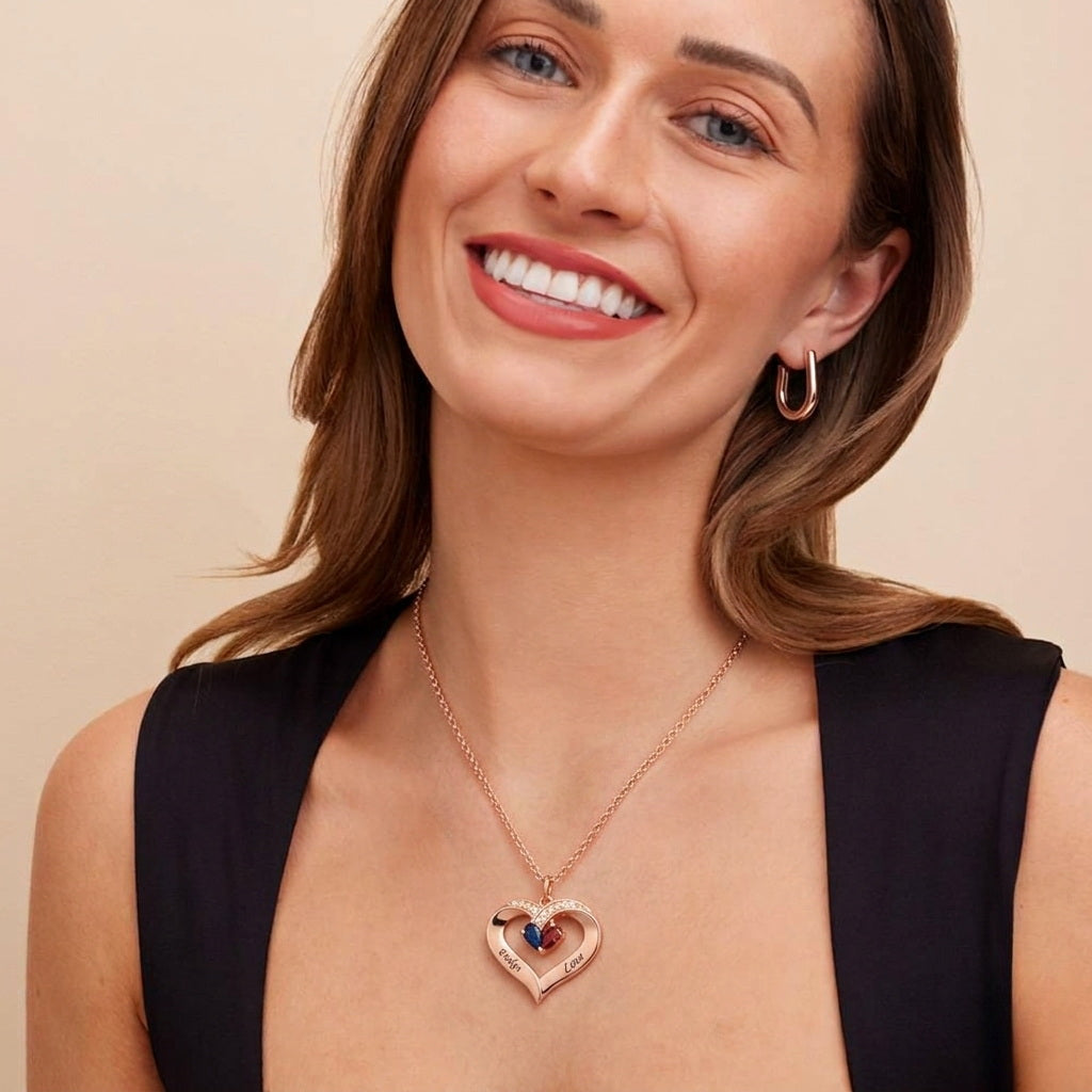 Woman wearing a rose gold heart birthstone necklace