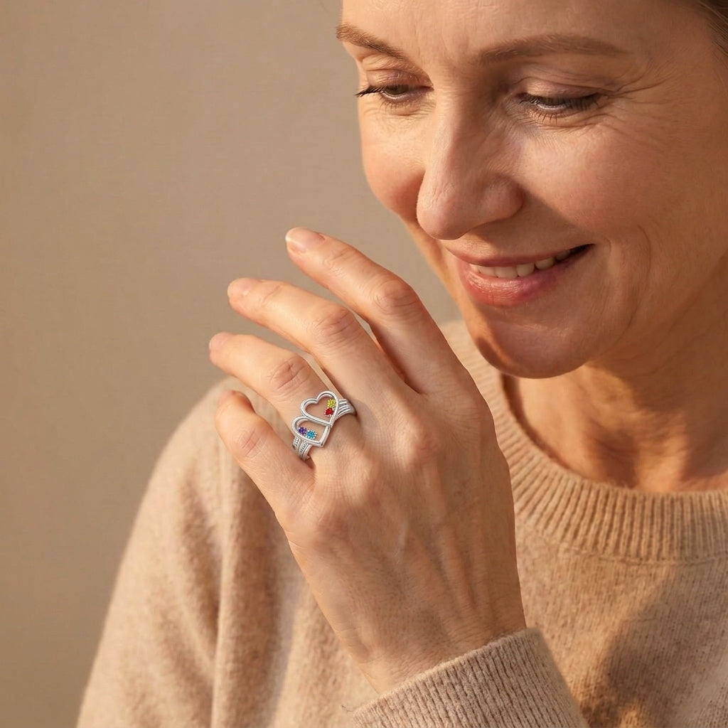 Custom two heart family name ring on hand jewelry view
