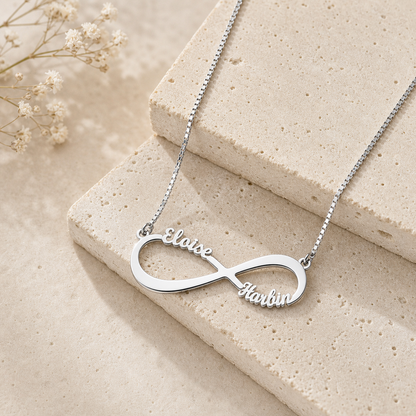 Sterling silver infinity loop pendant with custom family names.