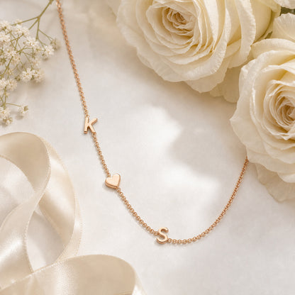 Initial name necklace in a floral scene