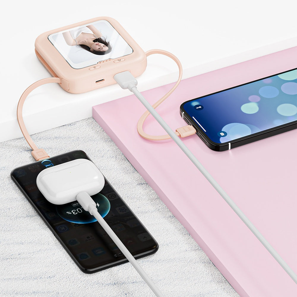 Personalized power bank charging a phone and earbuds.