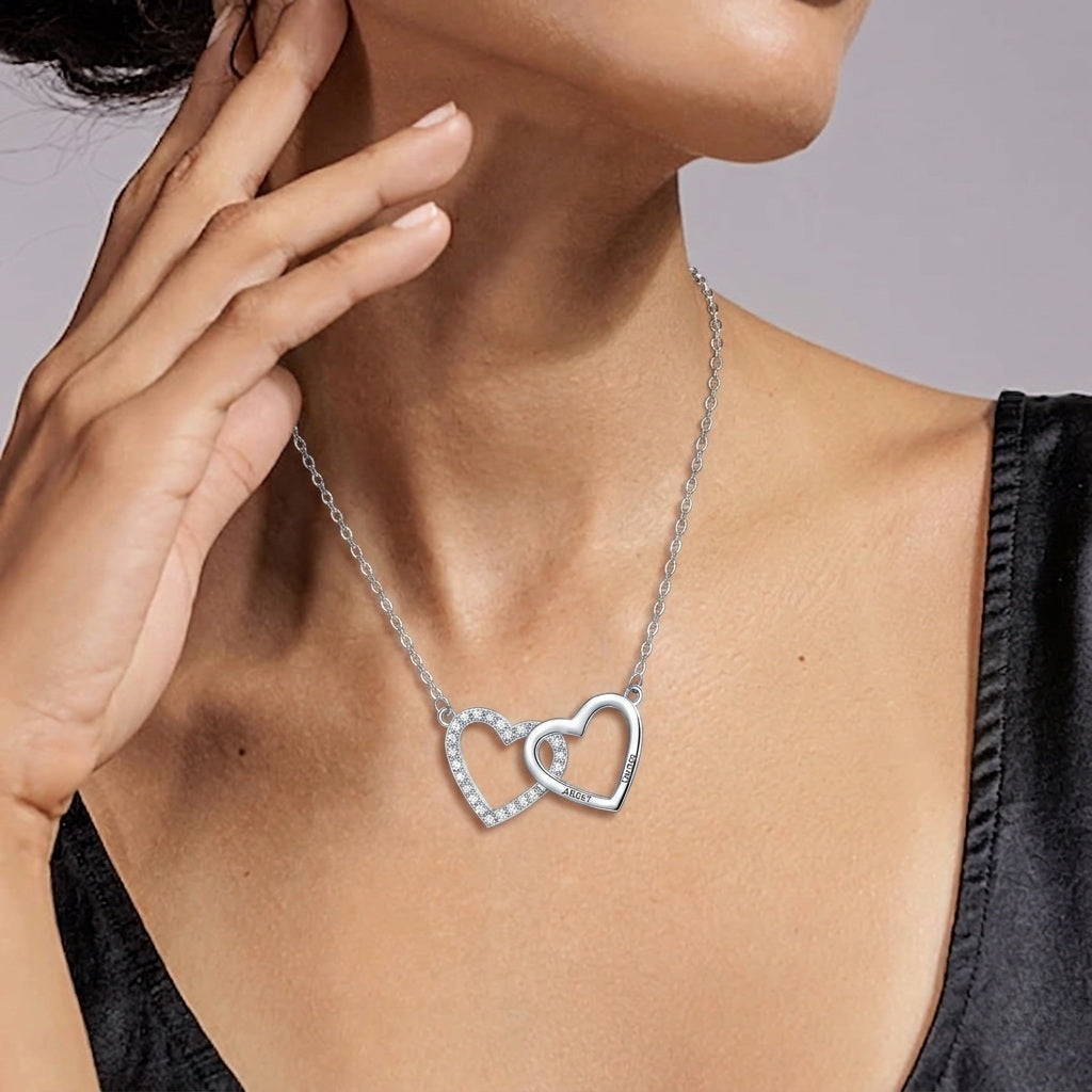 Close up of Albert and Teresa interlocking necklace