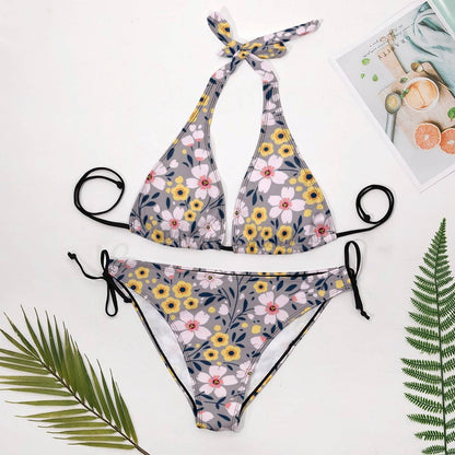 Flat lay of Halter Bikini Set and Side Tie Bottoms. Shows the Triangle style and all-over floral print.