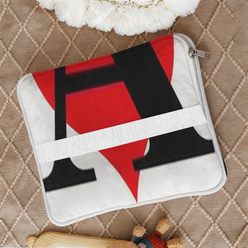 Folded custom pillow with zipper and white carrying strap.