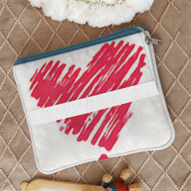 Foldable zippered cushion with a red heart pattern.