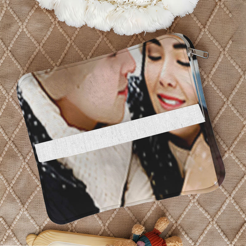 Folded romantic photo pillow with a zipper and strap.