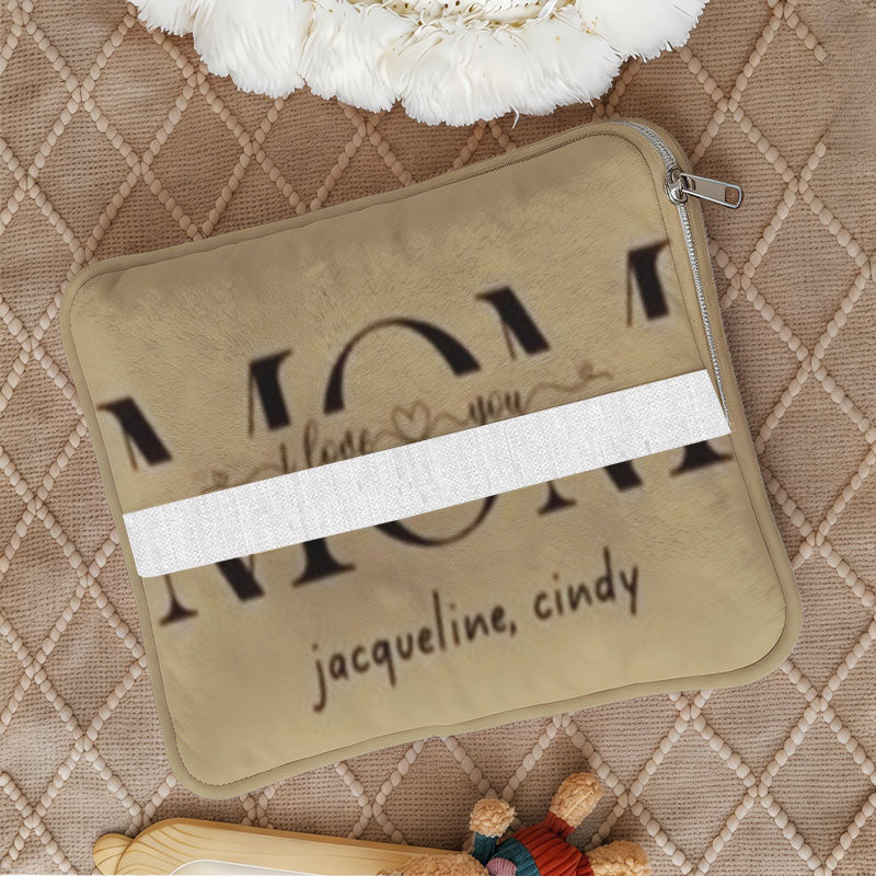 Close-up of folded tan name pillow with zipper closure