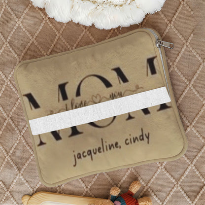 Close-up of folded tan name pillow with zipper closure