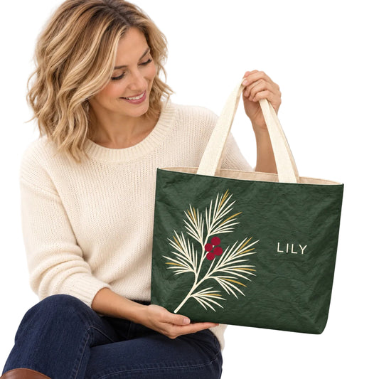 Personalized Forest Green Pine and Berry Tote Bag with Custom Name showing the custom name and botanical design detail