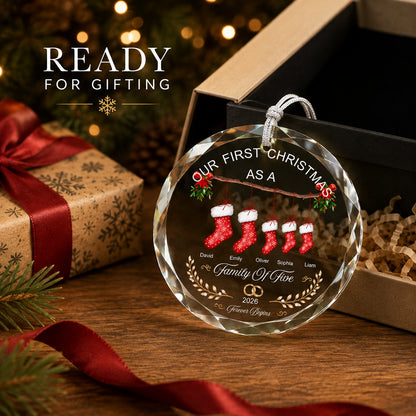 Gift-ready personalized family Christmas ornament beside an open gift box with ribbon and Christmas decor