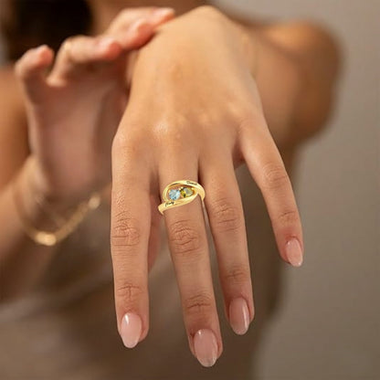 Model wearing a customized gold plated birthstone ring with heart stones.