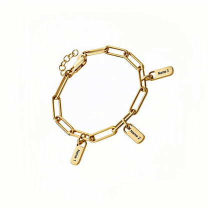 Gold plated custom paperclip chain bracelet with 3 engraved name charms. Gift for her.
