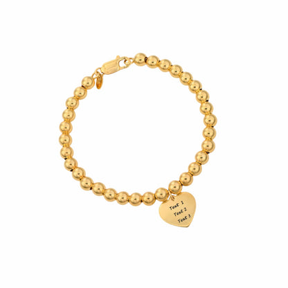 Gold plated bead ball bracelet with engraved name or mantra text on a heart pendant, for women.