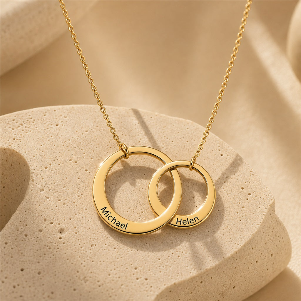 Interlocking circle name necklace close-up in gold