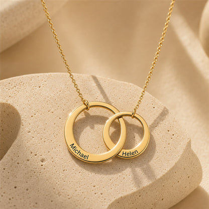 Interlocking circle name necklace close-up in gold