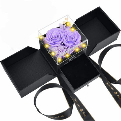 Elegant lavender purple eternal roses in a glowing LED jewelry display box.