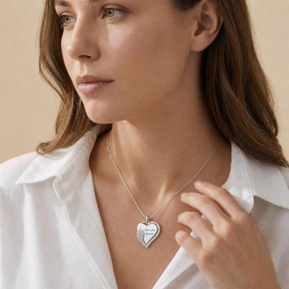 Woman wearing an angel wing heart necklace