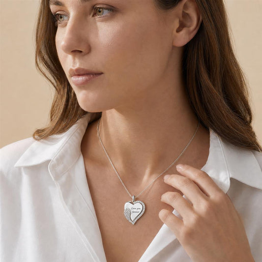 Woman wearing an angel wing heart necklace