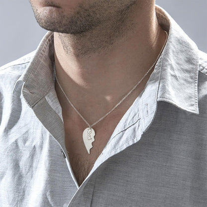 Man wearing custom engraved split heart best friend necklace, part of a matching set.