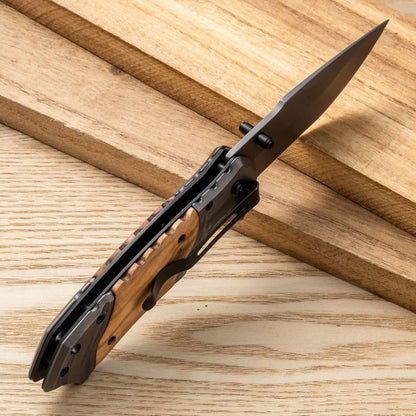 Close-up of the deeply engraved personalized text on the knife blade.