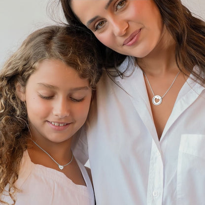 Model wearing custom Mother Daughter necklace set, engraved Mom necklace.