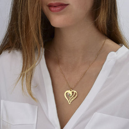 Model wearing custom double heart name necklace with two stones.