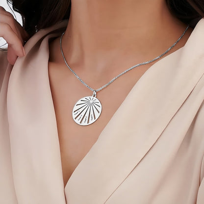 Model wearing the personalized sterling silver family round necklace, showing the size and fit on the neckline.