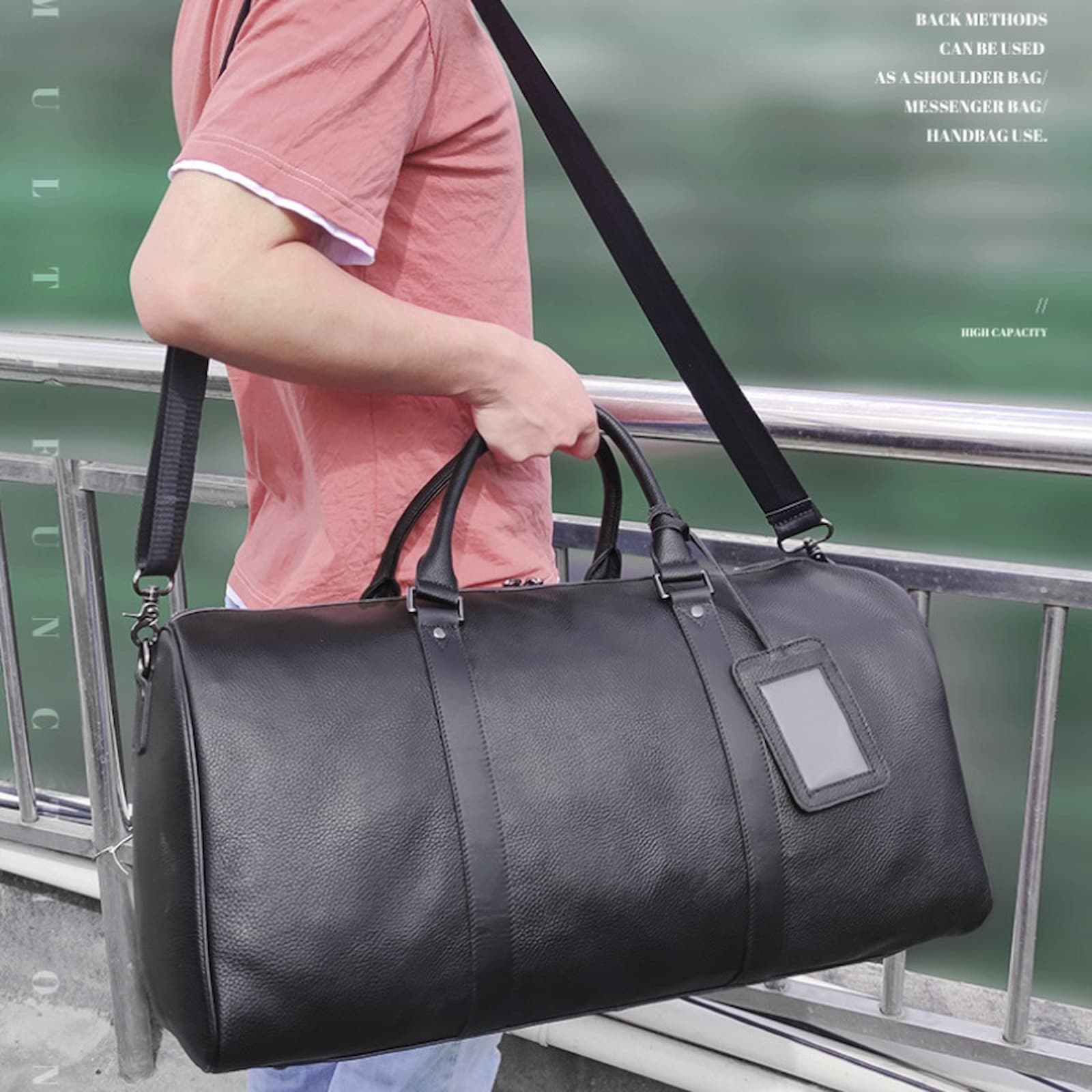 Professional black leather duffle bag suitable for business trips and carry-on use, with personalized initials.