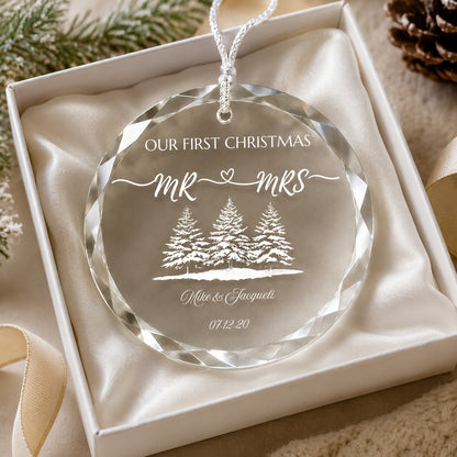 Our First Christmas Mr & Mrs Forest Design personalized glass ornament in hand scale view