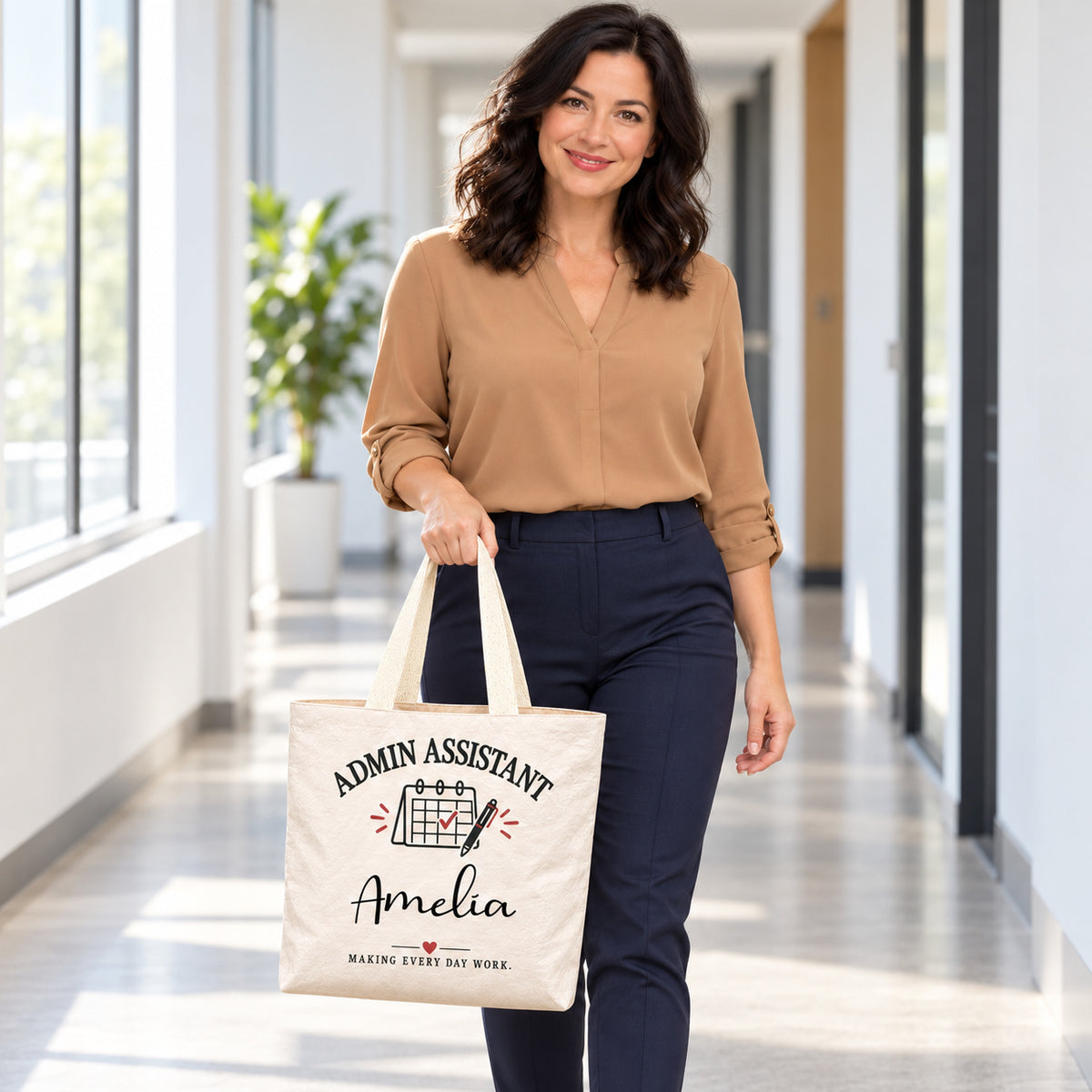 Cream Admin Assistant tote personalized with Amelia, carried by a model during an everyday outing.
