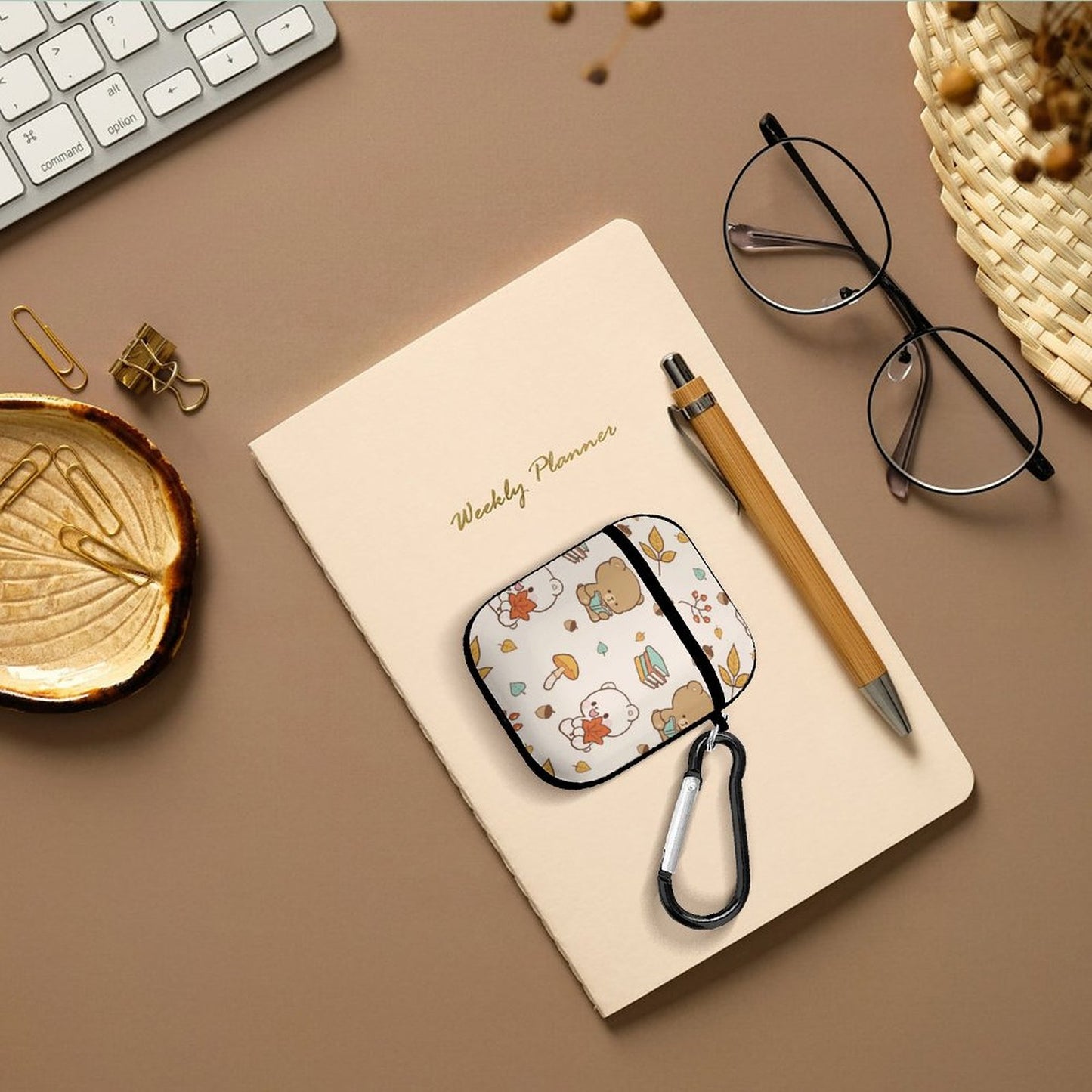 Personalized AirPod Case Cover used in office setting with planner.