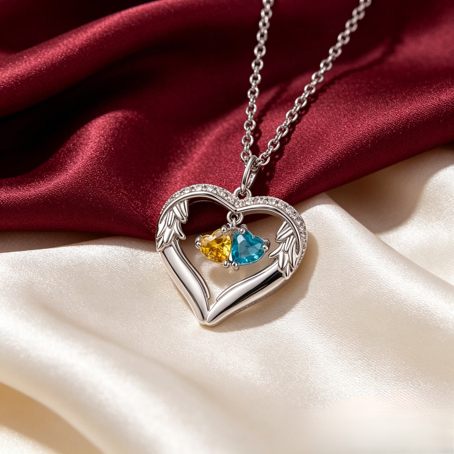 Silver angel wing birthstone necklace on satin
