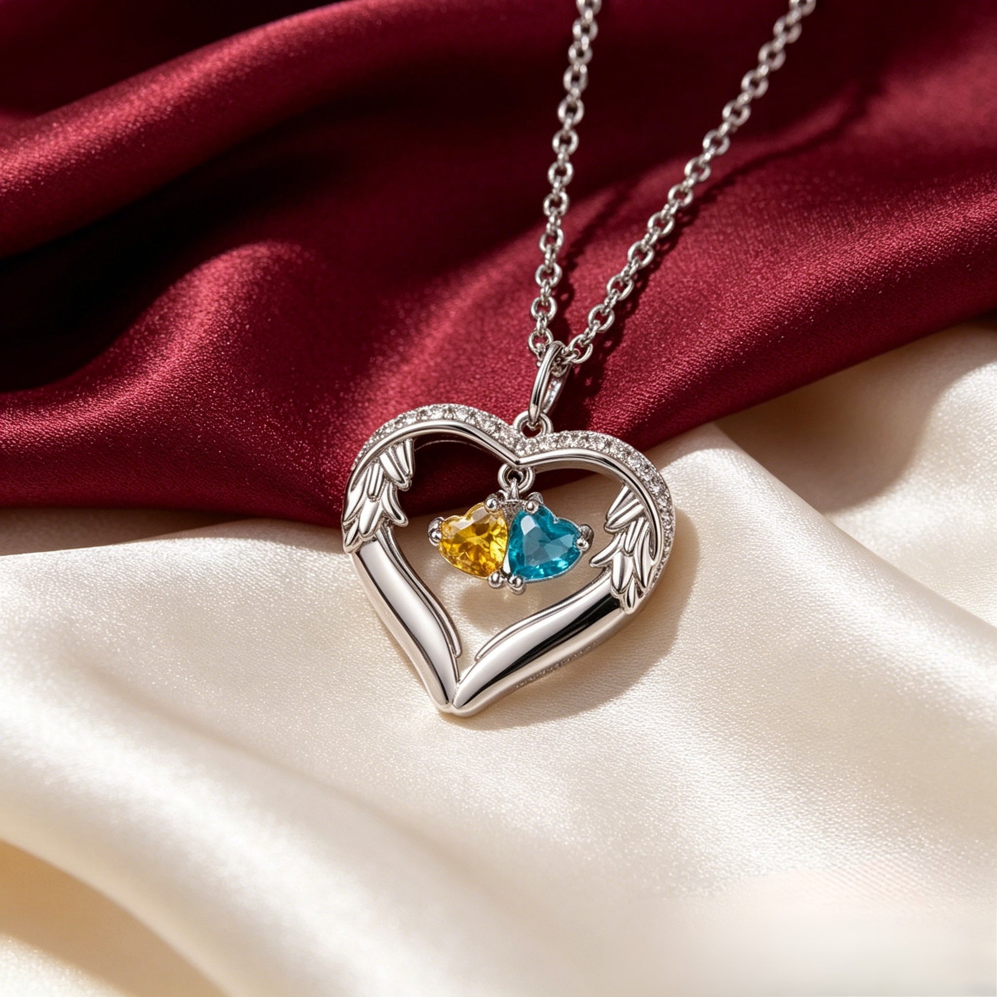 Silver angel wing birthstone necklace on satin