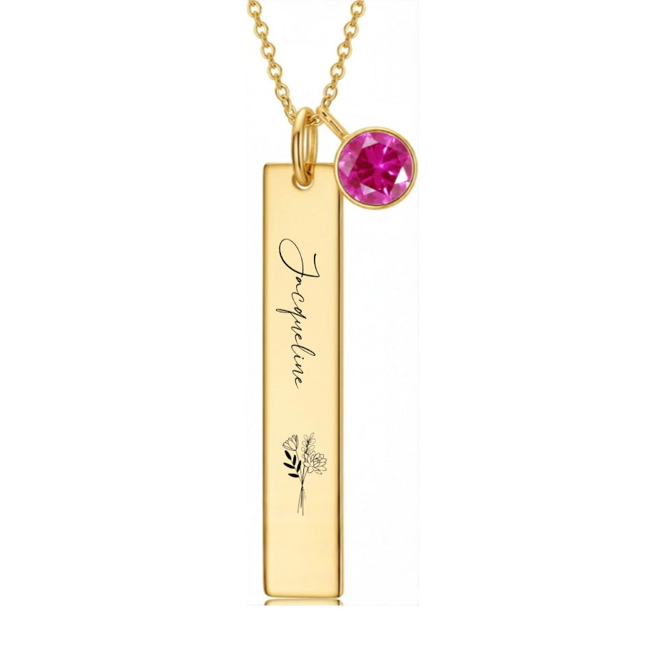 Gold vertical bar pendant with custom floral engraving.