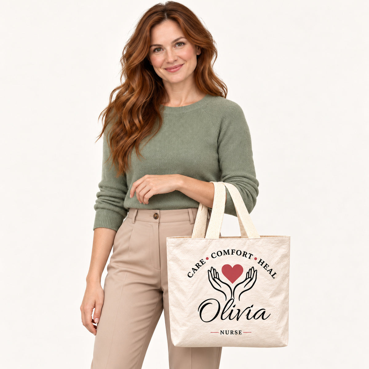 Cream Care Comfort Heal tote personalized with Olivia, carried on a model¡¯s forearm with the printed front visible.