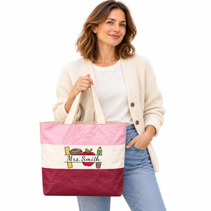 Pink, cream and burgundy teacher tote with school supplies artwork and Mrs. Smith in script on a white background.