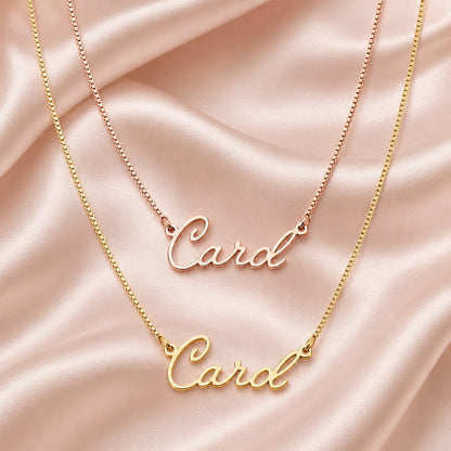 Layered rose gold and gold cursive name necklaces.