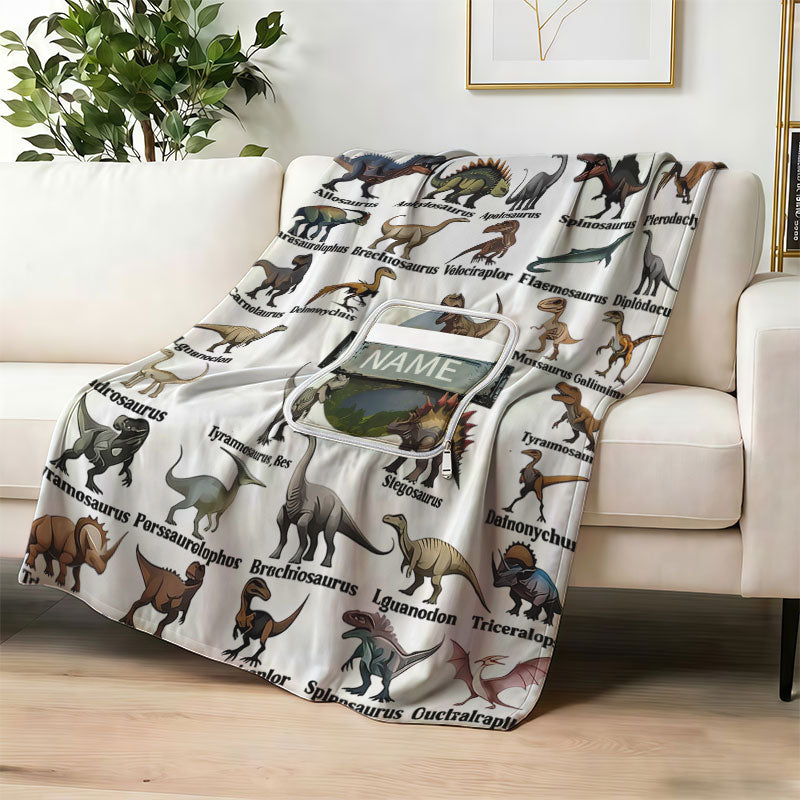 Custom dinosaur encyclopedia blanket on a white sofa.