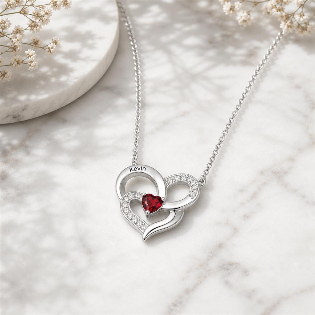 Double heart necklace on marble