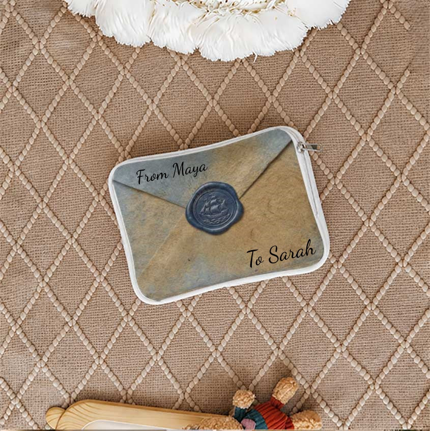 Closed envelope pouch with "From Maya To Sarah" text.