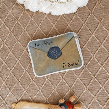 Closed envelope pouch with "From Maya To Sarah" text.