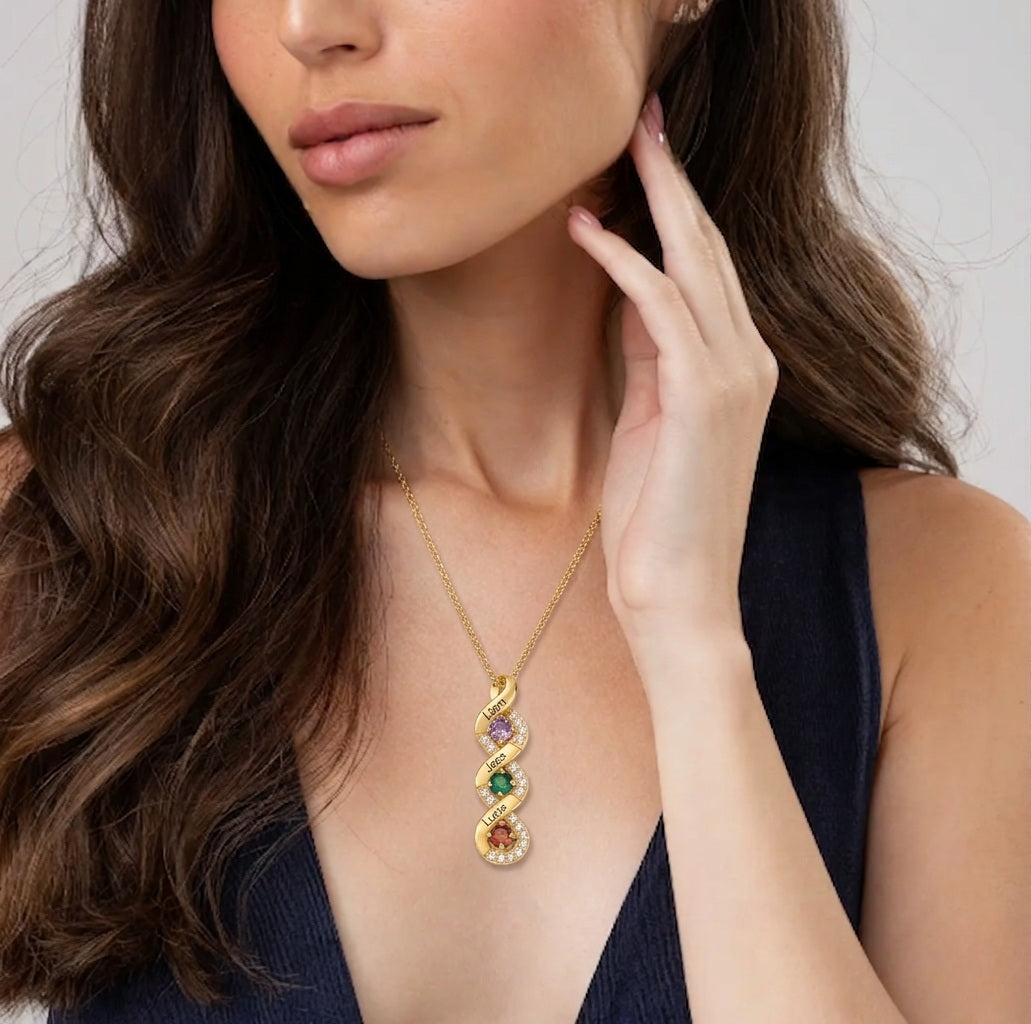 Woman wearing a family birthstone name necklace