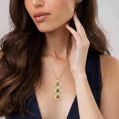 Woman wearing a family birthstone name necklace
