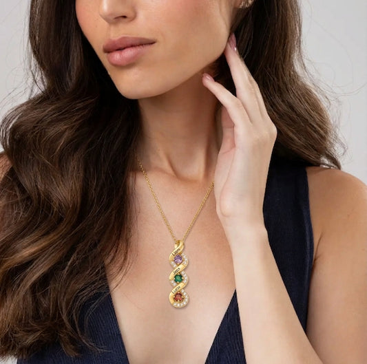 Woman wearing a family birthstone name necklace