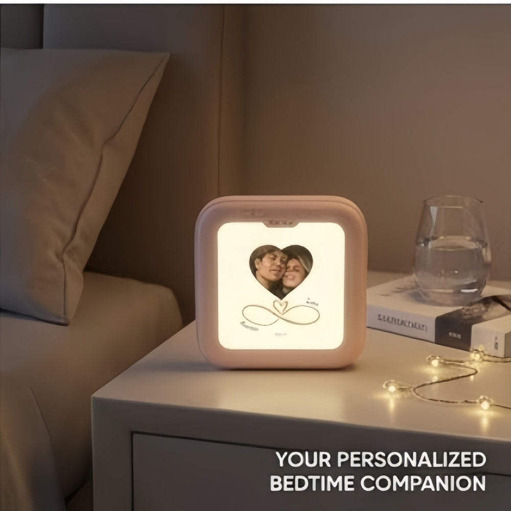 Personalized heart photo power bank on a bedside table.
