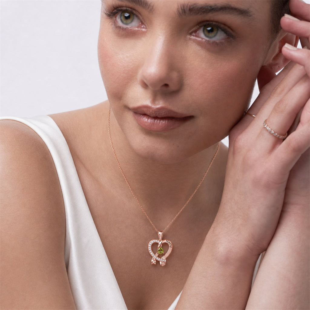 Model wearing personalized rose gold heart ribbon necklace