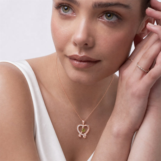 Model wearing personalized rose gold heart ribbon necklace