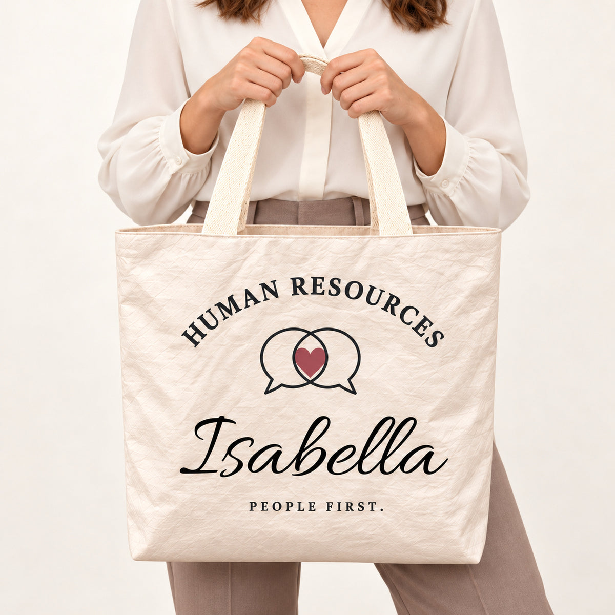 Cream Human Resources tote personalized with Isabella, shown close up with the custom name and printed artwork visible.